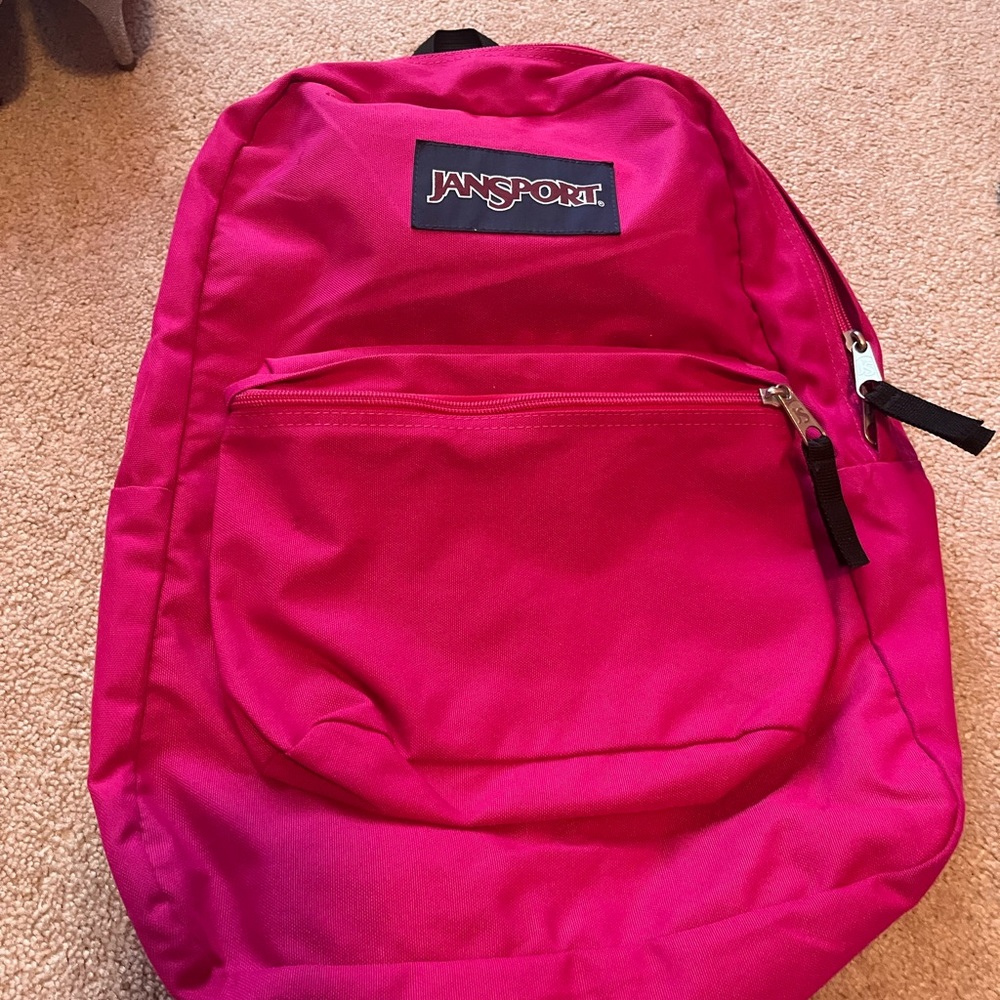 Hi! This a mini pink Jansport book-bag.